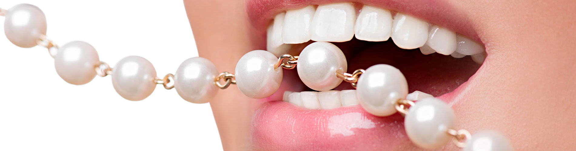 Woman biting on a pearl neckless